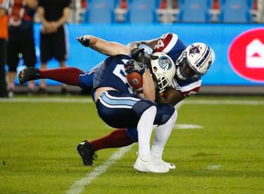 Montreal Alouettes Fabion Foote DT (94) hauls down Toronto Argonauts Cam McDaniel RB (27) in the fourth quarter during pre-season CFL action in Toronto, Ont. on Thursday June 8, 2017. Jack Boland/Toronto Sun/Postmedia Network
