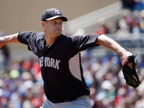 New York Yankees starting pitcher Chris Leroux delivers in a spring training baseball game against the Toronto Blue Jays in Dunedin, Fla., Wednesday, March 26, 2014. (THE CANADIAN PRESS/AP, Kathy Willens)