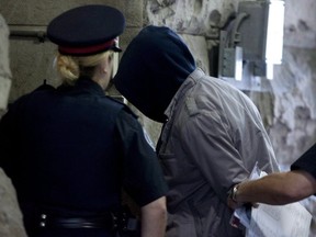 Christopher Husbands is led to court in Toronto on June 4, 2012.( THE CANADIAN PRESS)
