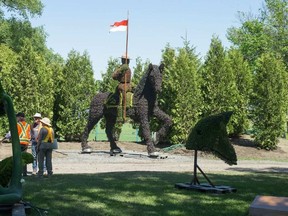 A mountie on horseback as we get a sneak peek tour of the MosaiCanada 150 gardens opening at the end of June in Jacques Cartier Park in Gatineau. WAYNE CUDDINGTON / POSTMEDIA