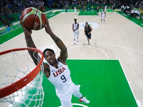 United States' DeMar DeRozan dunks the ball during a quarterfinal round basketball game against Argentina at the 2016 Summer Olympics in Rio de Janeiro, Brazil, on Aug. 17, 2016. The IOC has approved 3-on-3 basketball for the 2020 Summer Games in Tokyo. (Charlie Neibergall/AP Photo/Files)