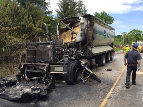 Fire destroyed a transport truck loaded with chicken feed west of London during the noon hour Friday after fuel leaked onto the truck?s engine. Flames were said to be as high as 20 metres. The truck driver escaped injury. About 40 litres of fuel leaked from the vehicle. (CHARLIE PINKERTON, The London Free Press)