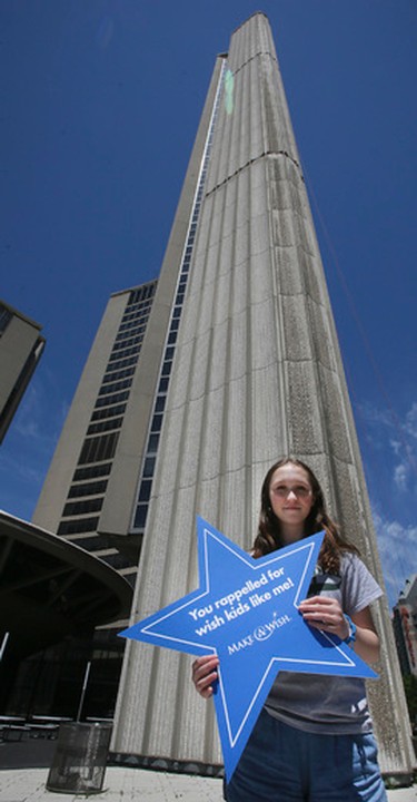 Stephanie Clayton stands at the base of the east tower of   City Hall on Friday June 9, 2017.  Many will be rappelling down the wall to raise funds for the Make A Wish foundation. The goal of the Rope for Hope campaign is to raise over a million dollars. Veronica Henri/Toronto Sun/Postmedia Network