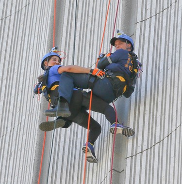 Firefighter Rob Wonfor rappelling down City Hall with a member of the media on Friday June 9, 2017. The goal of the Rope for Hope campaign is to raise over a million dollars for the Make a Wish foundation.Veronica Henri/Toronto Sun/Postmedia Network