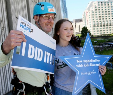 Reporter Kevin Connor poses for a picture with Stephanie Clayton after rappelling down City Hall on Friday June 9, 2017. The goal of the Rope for Hope campaign is to raise over a million dollars for the Make a Wish foundation.Veronica Henri/Toronto Sun/Postmedia Network