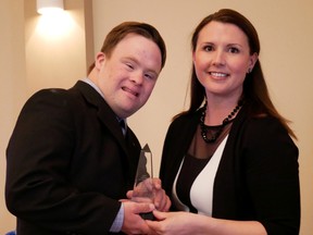 Tillsonburg District Chamber of Commerce president Stephanie Nevins presents the 2017 Tillsonburg Citizen of the Year Award to Matthew MacNeil. (Chris Abbott/Tillsonburg News)