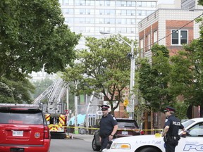 Roads are blocked off in the area surrounding a toxic fire inside a restaurant on Baldwin St. on Friday June 9, 2017. (Veronica Henri/Toronto Sun)