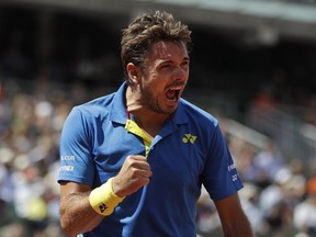 Switzerland's Stan Wawrinka clenches his fist after scoring a point against Britain's Andy Murray during their semifinal match at the French Open in Paris on Friday, June 9, 2017. (AP Photo/Petr David Josek)