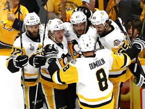 Sidney Crosby of the Pittsburgh Penguins celebrates with teammates after scoring a goal against the Nashville Predators during Game 4 of the Stanley Cup Final at the Bridgestone Arena on June 5, 2017. (Bruce Bennett/Getty Images)