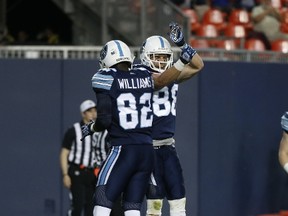 Toronto Argonauts receiver Jimmy Ralph celebrates his winning TD with Malcom Williams early in the fourth quarter during pre-season CFL action in Toronto on June 8, 2017. (Jack Boland/Toronto Sun/Postmedia Network)
