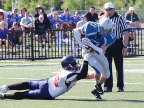 Jared Loyer, right, of the Sudbury varsity Gladiators, is pulled down by a Vaughan Rebels player during football action at James Jerome Sports Complex on Saturday, June 3, 2017. John Lappa/Sudbury Star