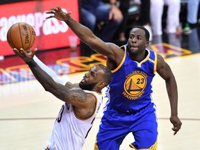 LeBron James of the Cleveland Cavaliers attempts a shot while Draymond Green of the Golden State Warriors defends in Game 4 of the NBA Finals at Quicken Loans Arena on June 9, 2017 in Cleveland. (Jason Miller/Getty Images)