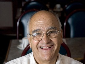 Sam Panopolous displays his 1962 invention, the Hawaiian pizza, in this 2010 file photo. Panopolous died Thursday, June 8, 2017 in a London, Ont., hospital. He was 83. (Derek Ruttan/Postmedia Network File Photo)