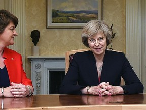This is a July 25, 2016  file photo of of Arlene Foster, left, leader of the Democratic Unionist Party, with Britain's Conservative Prime Minister Theresa May, during a meeting in Belfast.  ﻿﻿﻿﻿﻿﻿﻿﻿﻿﻿﻿ (Charles McQuillan/PA, File via AP)