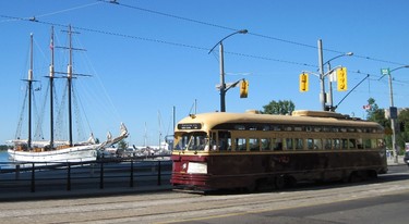 One of the two vintage PCC streetcars retained by the TTC is pictured eastbound on Queen’s Quay W. at the foot of Spadina Ave. People can take a trip back in time every Sunday until Labour Day weekend by riding one of these vintage PCC streetcars on the 509 Harbourfront Route.  The TTC’s classic burgundy-and-cream-coloured streetcar can be boarded from about noon to 5 p.m., on Sundays only. These PCC rides are operated free of charge.