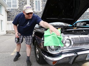 Robert Grenier cleans off his 1964 Dodge Polara at the Cruisin' for Organ Donors and "Rich" event at Rayside Balfour Days in Chelmsford, Ont. on Saturday June 10, 2017. More than 200 show cars were on display to help raise awareness of the importance of organ donors. The campaign is sponsored by The Sudbury Star. John Lappa/Sudbury Star/Postmedia Network