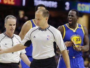 Warriors forward Draymond Green (right) yells at referee John Goble during the first half against the Cavaliers in Game 4 of the NBA Finals in Cleveland on Friday, June 9, 2017. (Tony Dejak/AP Photo)