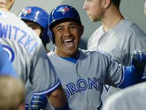 Toronto Blue Jays' Ezequiel Carrera reacts in the dugout after he hit a home run during the eighth inning  against the Seattle Mariners on Saturday night. The Jays won 4-2. (AP)