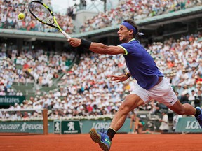 Spain's Rafael Nadal plays a shot against Switzerland's Stan Wawrinka during their men's final match of the French Open tennis tournament at the Roland Garros stadium, in Paris, France, Sunday, June 11, 2017. (AP Photo/Christophe Ena)