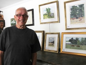 Sarnia artist J.Allison Robichaud stands by some of his plein air paintings in his home studio Sunday. The 85-year old recently wrote his fifth book. Tyler Kula/Sarnia Observer/Postmedia Network