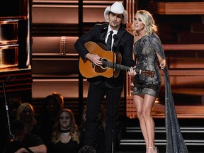 Co-hosts Brad Paisley and Carrie Underwood perform onstage at the 50th annual CMA Awards at the Bridgestone Arena on Nov. 2, 2016 in Nashville, Tenn. (Gustavo Caballero/Getty Images)