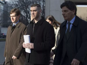 Adam Picard (centre) exits the Ottawa Courthouse with his lawyer Lawrence Greenspon (R) on Tuesday November 15, 2016. ERROL MCGIHON / POSTMEDIA