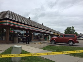 Edmonton police investigate a shooting at a shopping centre at 11868 145 Ave. in the Carlisle neighbourhood the afternoon of Sunday. (Catherine Griwkowsky)