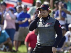 Ariya Jutanugarn wipes a tear after winning the Manulife LPGA Classic at Whistle Bear Golf Club in Cambridge yesterday. (The Canadian Press)