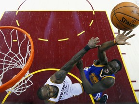 LeBron James of the Cleveland Cavaliers defends against Draymond Green of the Golden State Warriors during Game 4 of the NBA Finals at Quicken Loans Arena on June 9, 2017 in Cleveland. (Larry W. Smith — Pool/Getty Images)