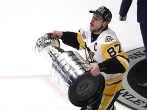 Sidney Crosby of the Pittsburgh Penguins celebrates with the Stanley Cup after they defeated the Nashville Predators at the Bridgestone Arena on June 11, 2017 in Nashville. (Patrick Smith/Getty Images)