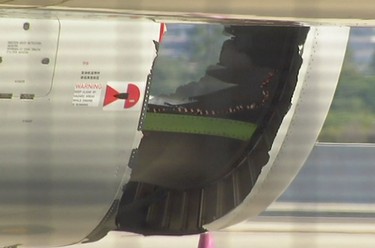 In this image made from video, a hole is seen in the engine of China Eastern airlines Flight 736 after it landed in Sydney, Australia, Monday, June 12, 2017. China Eastern said the crew on Flight 736 noticed damage to the air inlet on the left engine after takeoff Sunday evening and the captain decided to return. (Australian Broadcasting Corporation via AP)