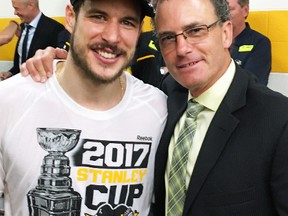 Mitchell native Jay Heinbuck (right), of the amateur scouting department of the Pittsburgh Penguins, poses with Conn Smythe trophy winner and Penguins' captain Sidney Crosby after the Penguins won their second consecutive Stanley Cup Sunday, June 11 in Nashville, Tenn. SUBMITTED