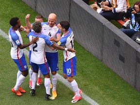 The USA's Michael Bradley (C) celebrates after scoring a goal against Mexico during their 2018 FIFA World Cup Concacaf qualifier football match in Mexico City, on June 11, 2017. The match ended 1-1. / AFP PHOTO / YURI CORTEZYURI CORTEZ/AFP/Getty Images