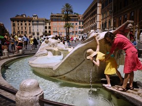 People drink from Italian 17th Century sculptor Bernini's Barcaccia fountain, just next to the Spanish steps, in Rome, Monday, June 12, 2017. City hall on Monday announced that Mayor Virginia Raggi had signed an ordinance aimed at protecting some 40 fountains of historic or artistic interest to try to protect the monumental works, not infrequently trashed by tourists, sports fans and Romans. (AP Photo/Andrew Medichini)