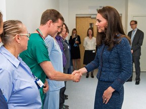 Catherine, Duchess of Cambridge, right, speaks to Dr Mark Haden as she visits Kings College Hospital to meet staff and patients affected by the terrorist attacks at London Bridge and Borough Market on June 3, in south London on June 12, 2017. (DOMINIC LIPINSKI/AFP/Getty Images)