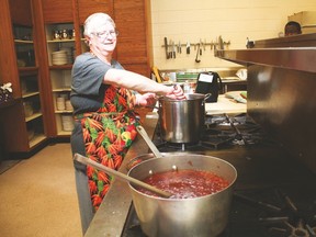 Lynda Joyce helps heat up a Russian beet borscht for the Multicultural Dinner, held May 31 at the Cultural-Recreational Centre.