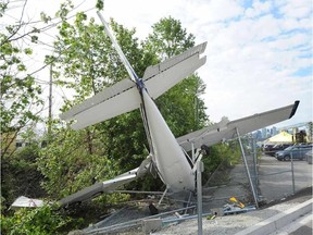 The wreckage of a Cessna plane after crashing in North Vancouver, B.C., June 12, 2017. The four occupants all survived after the plane lost power over the Lions Gate Bridge with one man sustaining a broken arm. (Nick Procaylo/Postmedia Network)