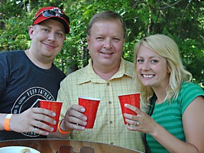 Ted Lange, centre, enjoys some craft beer with his son Josh and daughter Jenna for Father's Day during the first Craft Beer Picnic on the grounds of the Stratford Perth Museum in 2016. (Beacon Herald file photo)