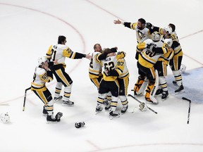 Matt Murray #30 of the Pittsburgh Penguins celebrates with teammates after they defeated the Nashville Predators 2-0 to win the 2017 NHL Stanley Cup Final at the Bridgestone Arena on June 11, 2017 in Nashville, Tennessee. (Photo by Patrick Smith/Getty Images)