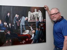 Kingston artist Pat Shea with his second painting depicting the United States Donald Trump presidency 'The impeachment of Donald Trump' on Monday. (Ian MacAlpine/The Whig-Standard)