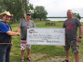 Andrew (middle) and Robert (right) Mainville accept the winner's cheque from a member of the Val Caron Knights of Columbus, which sponsored Sunday's Top 50 Pike Tournament Trail event on Whitewater Lake in Azilda. Bruce Heidman/The Sudbury Star