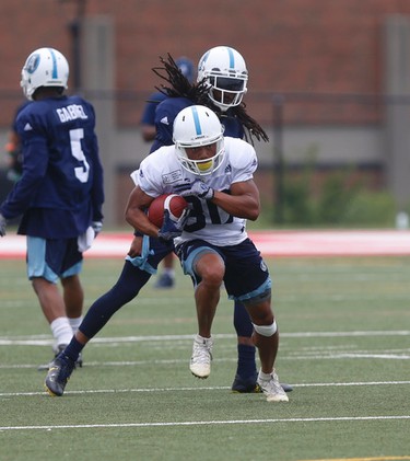 Toronto Argonauts Chandler Worthy WR (80) breaks a move past Johnny Sears Jr. DB (0) at their practice facility at York Univeristy  in Toronto, Ont. on Monday June 12, 2017. Jack Boland/Toronto Sun/Postmedia Network