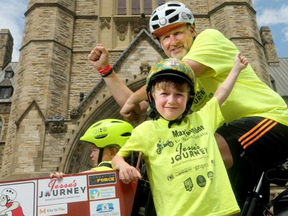 Max Sedmihradsky, six, along with his dad Andrew and little sister Isla, 18 mos., pulled onto Parliament Hill Monday (June 12, 2017) in their cargo bike after peddling from Hamilton to Ottawa for the third annual Max's Big Ride. JULIE OLIVER / OTTAWA CITIZEN