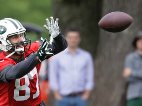 This May 23, 2017 file photo shows New York Jets wide receiver Eric Decker catching a pass during the team's organized team activities at its NFL football training facility in Florham Park, N.J. The New York Jets have released Decker, six days after saying they would do so if they couldn't work out a trade. The announcement Monday, June 12, 2017 officially ends his tenure with the team after three seasons. (AP Photo/Julio Cortez, file)