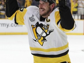 Pittsburgh Penguins' Sidney Crosby (87) celebrates with the Stanley Cup after defeating the Nashville Predators in Game 6 of the NHL Stanley Cup Final, Sunday, June 11, 2017, in Nashville, Tenn. (THE CANADIAN PRESS/AP/Mark Humphrey)