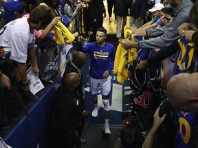 OAKLAND, CA - JUNE 12: Stephen Curry #30 of the Golden State Warriors reacts after making a shot from the tunnel during warmups prior to Game 5 of the 2017 NBA Finals at ORACLE Arena on June 12, 2017 in Oakland, California. (Photo by Ezra Shaw/Getty Images)