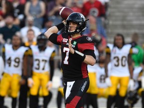 Ottawa Redblacks quarterback Trevor Harris throws the ball against the Hamilton Tiger-Cats during the first half of a pre-season CFL football game in Ottawa on Thursday, June 8, 2017. (THE CANADIAN PRESS/Justin Tang)