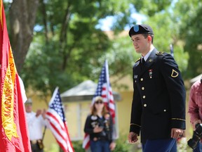 Army reservist Harland Fletcher walks on stage to receive his high school diploma during a private graduation ceremony Monday, June 12, 2017, in Brentwood, Calif. The Liberty High School principal held the ceremony as an apology for not allowing Fletcher to wear his military uniform during his graduation last Friday. (AP Photo/Linda Wang)
