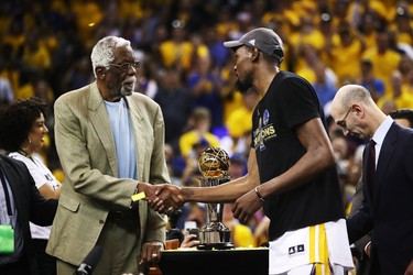 OAKLAND, CA - JUNE 12:  Kevin Durant #35 of the Golden State Warriors is presented the Bill Russell NBA Finals Most Valuable Player Trophy by NBA Hall of Famer Bill Russell after defeating the Cleveland Cavaliers 129-120 in Game 5 to win the 2017 NBA Finals at ORACLE Arena on June 12, 2017 in Oakland, California. NOTE TO USER: User expressly acknowledges and agrees that, by downloading and or using this photograph, User is consenting to the terms and conditions of the Getty Images License Agreement.  (Photo by Ezra Shaw/Getty Images)
