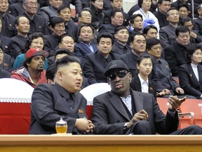 This file photo taken on February 28, 2013 and released by North Korea's official Korean Central News Agency (KCNA) shows North Korean leader Kim Jong-Un (front L) and former NBA star Dennis Rodman (front R) speaking at a basketball game in Pyongyang. Former basketball star Dennis Rodman is expected to arrive in Pyongyang on June 13, 2017, CNN and Fox news reported, his first visit in three years which comes as tensions between the US and North Korea soar.
